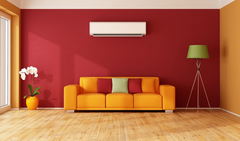 Red and orange living room with colorful sofa and ductless air conditioner - 3D Rendering
