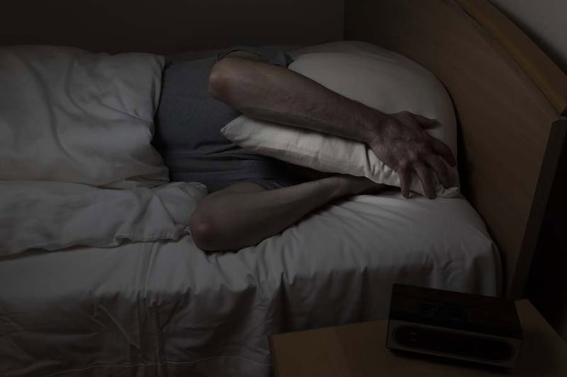 Man cannot sleep at night time.