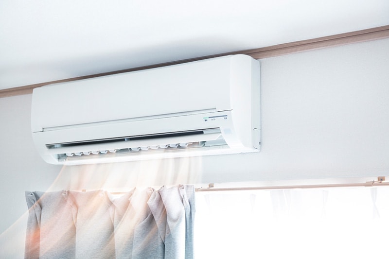 A ductless unit set above a window | Why Ductless Is The Way To Go | Save Money On Cooling | Maryville