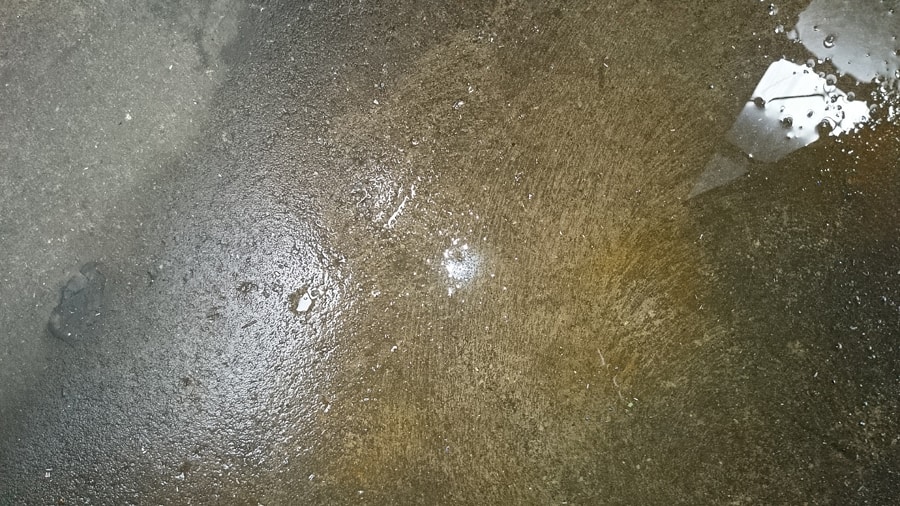Furnace leaking water onto basement floor.