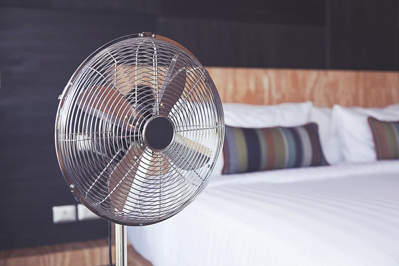 A fan in front of a bed | Improve Your Home’s Indoor Air Quality | Friendsville