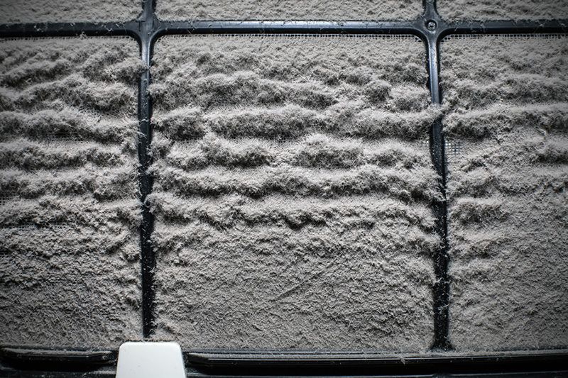 Image of a dusty air filter. A & L Heating and Air.