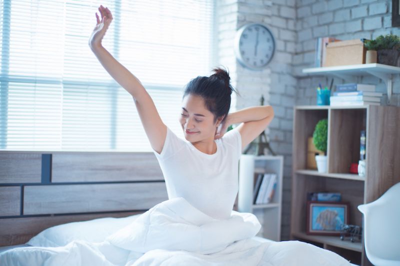 Image of person getting up from sleep. Your HVAC System Can Enhance Sleep.